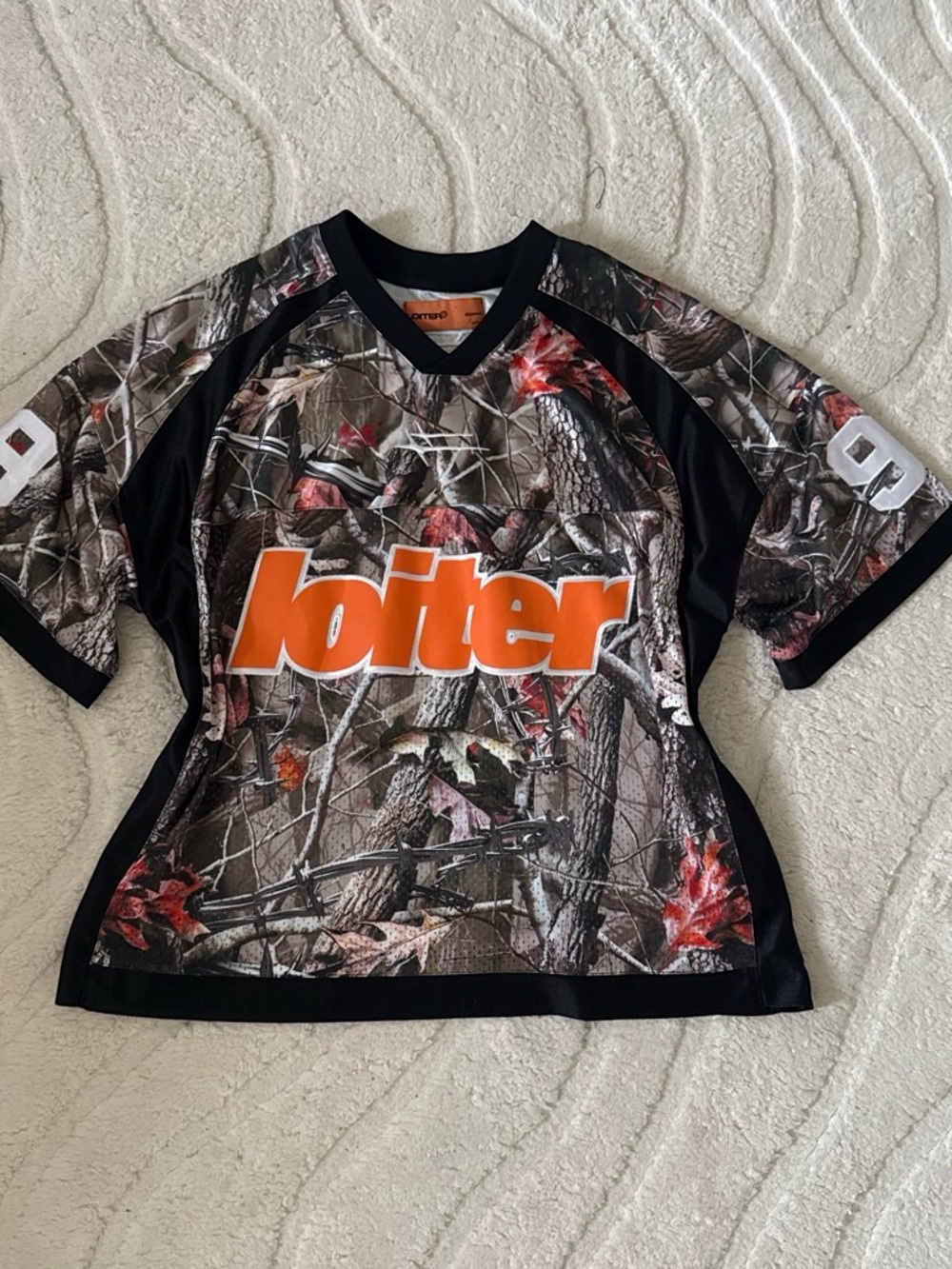 Women’s Camo Sports Jersey with Orange Logo